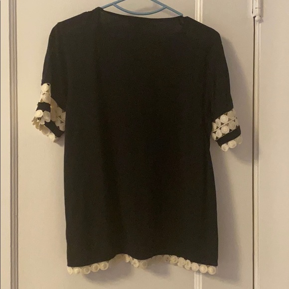 Black top with white detailed sleeves and bottom - Picture 2 of 3